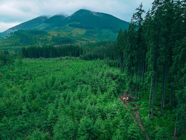 Couple travelers at mountains footpath aerial view