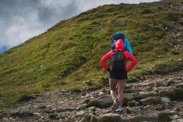 A couple of travelers in the Tatra Mountains on a summer hike High quality photo