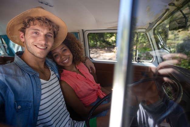 Couple travelling in campervan