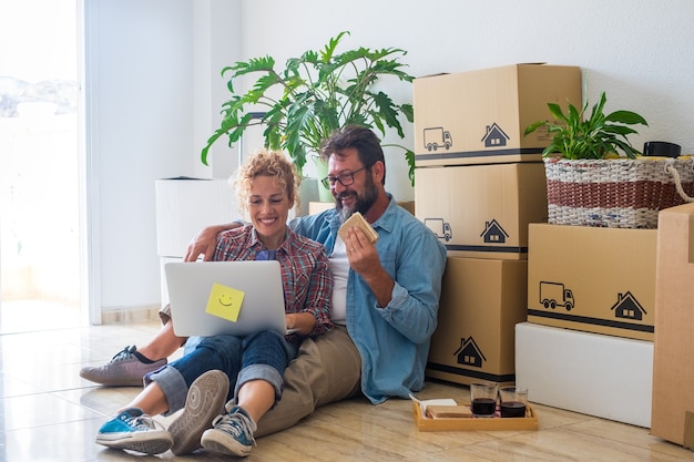 Couple of two adults and happy people after buy a new house or apartment together to live together