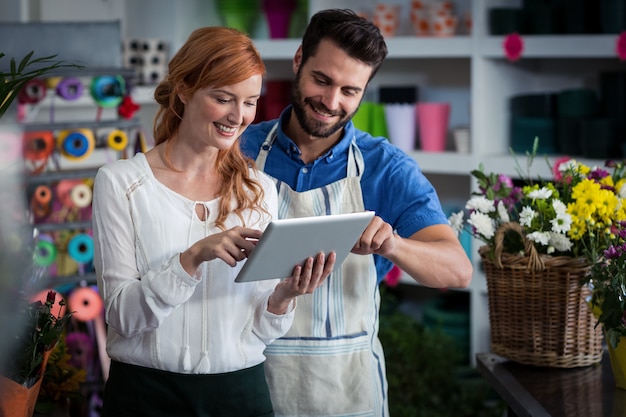 Couple using digital tablet