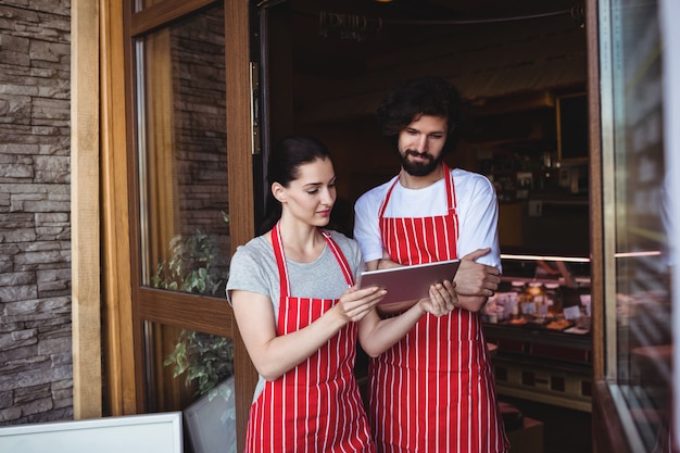 Couple using digital tablet