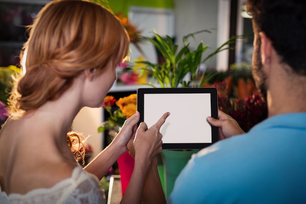 Couple using digital tablet