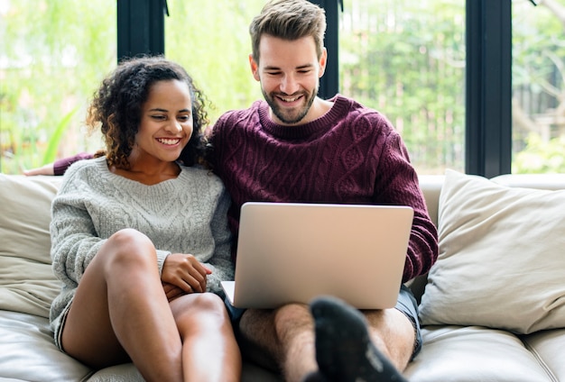 Couple using laptop together