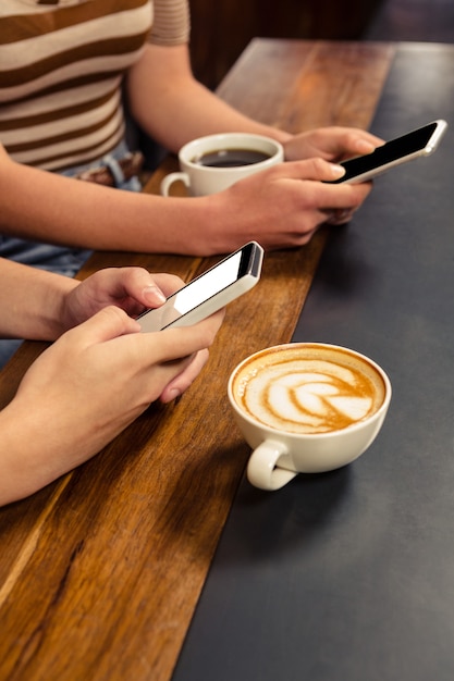 Couple using smartphones