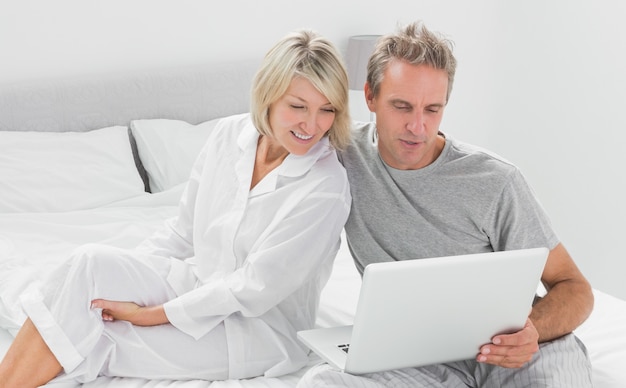 Couple using their laptop