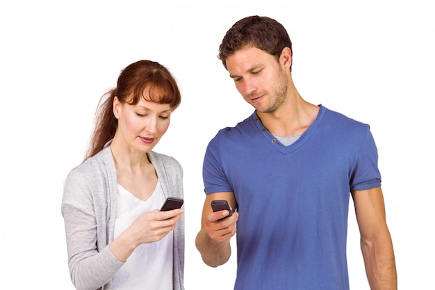 Couple using their mobile phones