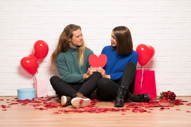 Couple in valentine day holding gift box