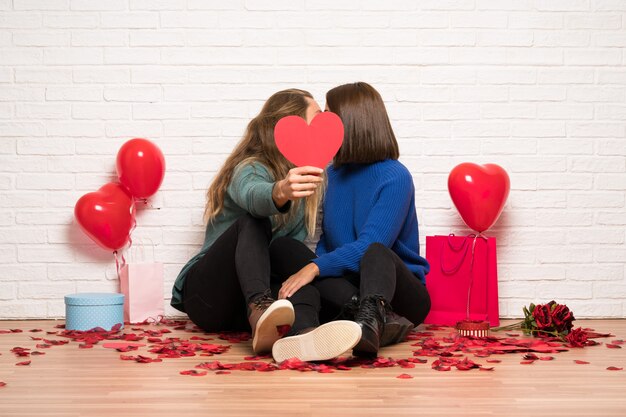 Couple in valentine day holding a heart symbol