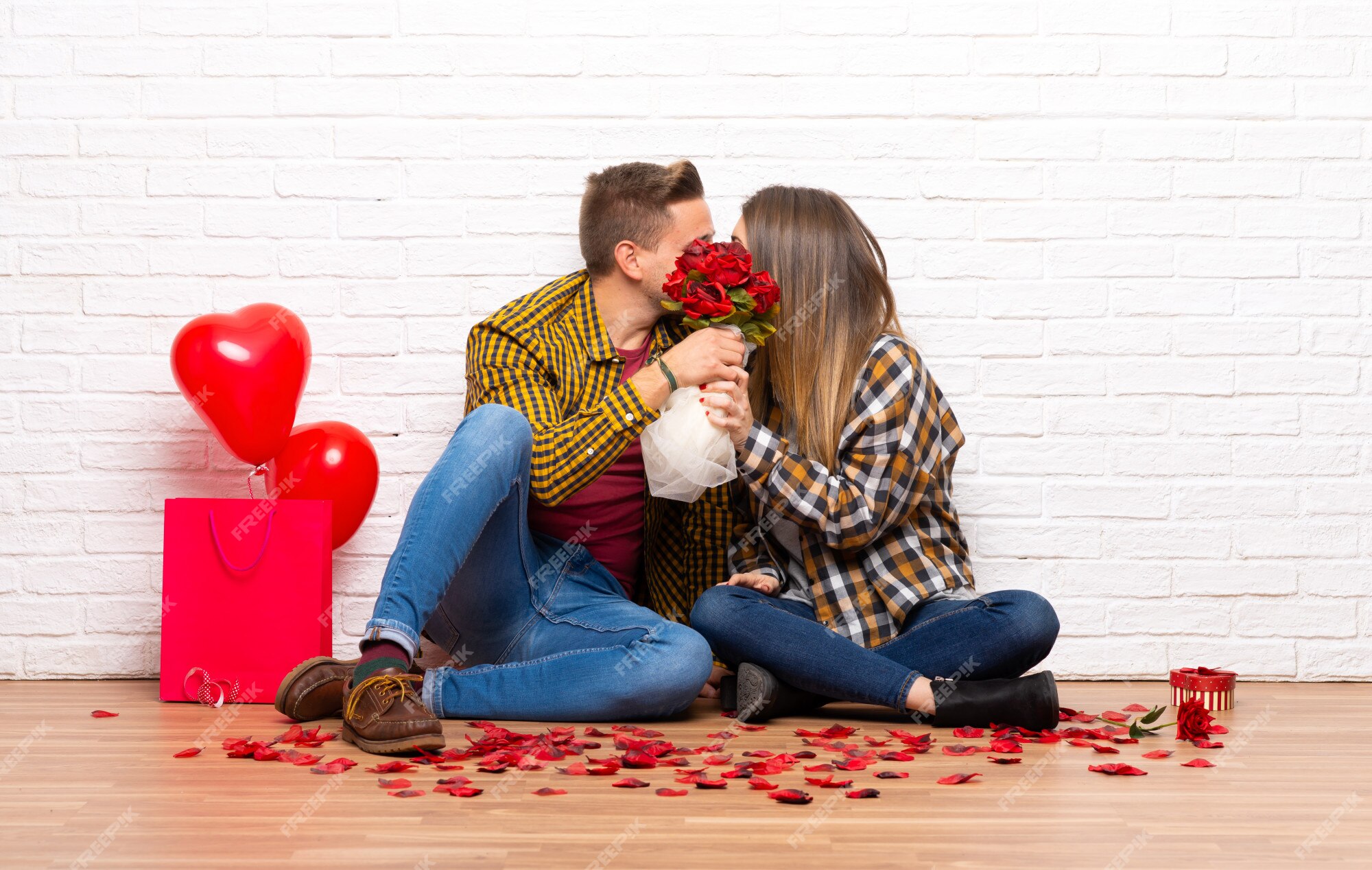 Premium Photo | Couple in valentine day at indoors with flowers and kissing