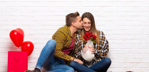 Couple in valentine day at indoors with flowers