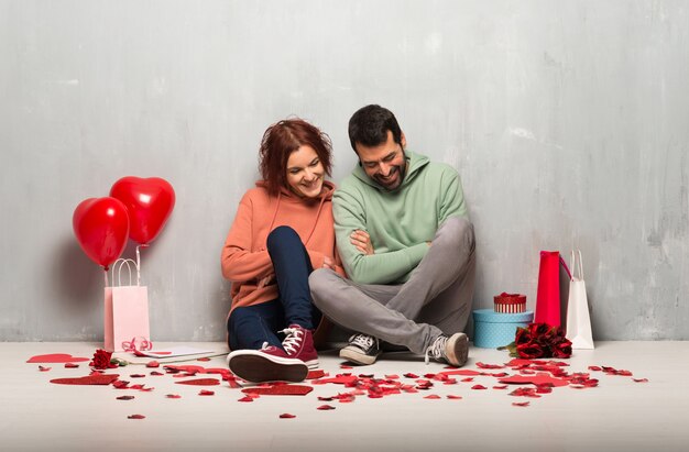 Couple in valentine day keeping the arms crossed while smiling