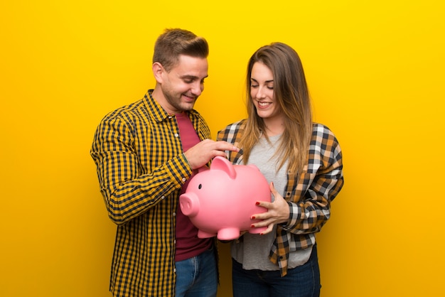 Couple in valentine day taking a piggy bank