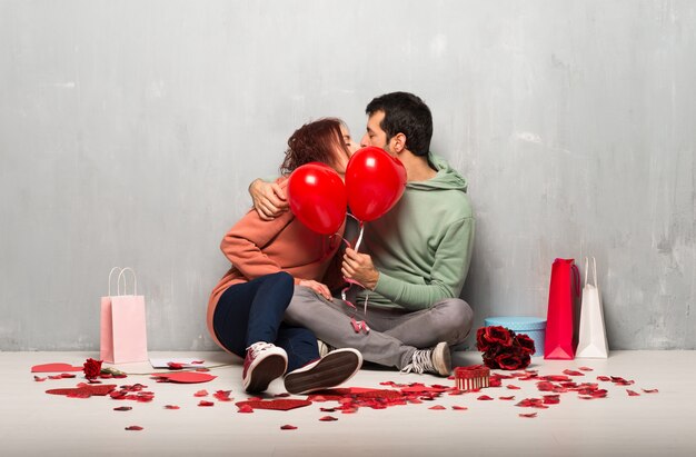 Couple in valentine day with balloons with heart shape