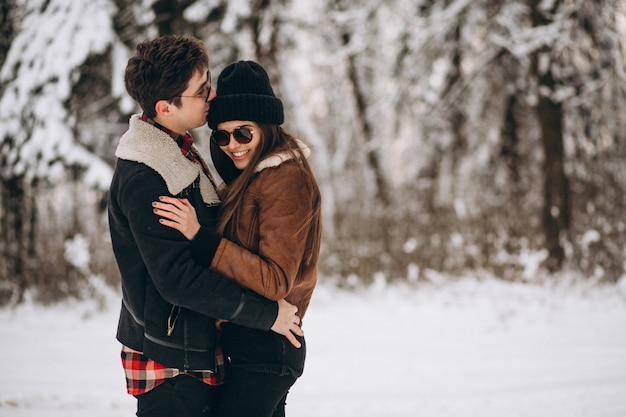 Couple on valentine's day in winter forest