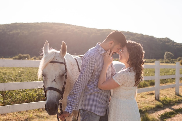 Couple walk at the ranch during summer day