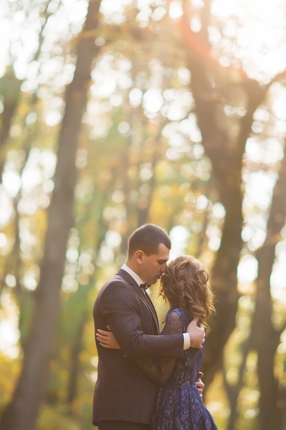 Couple walking in the autumn forest