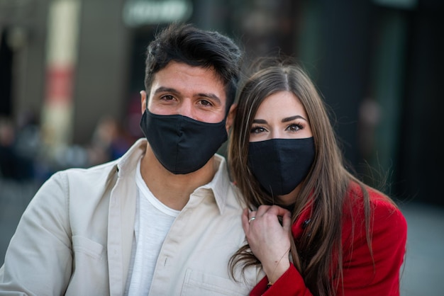 Couple walking in a city during coronavirus pandemic