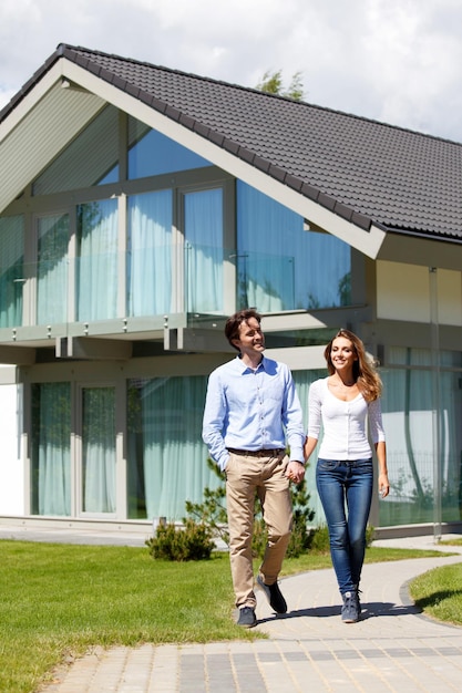 Couple walking from house