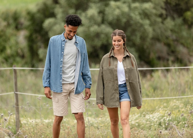 Couple walking in nature medium shot