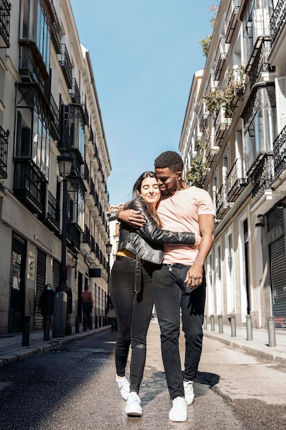 Couple walking on road in city