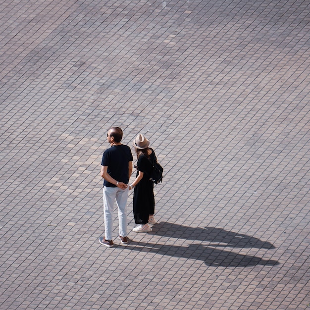 couple walking through the streets of bilbao on vacation