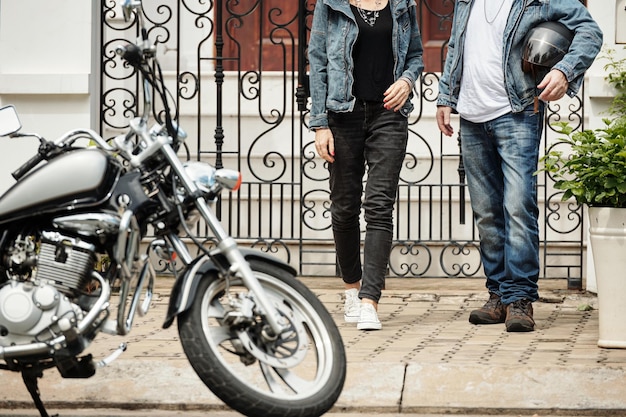 Couple Walking towards Motorcycle