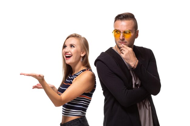 Couple watching look at something and have different emotions concept studio shot on white background