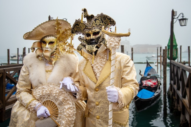 A couple wearing carnival costumes