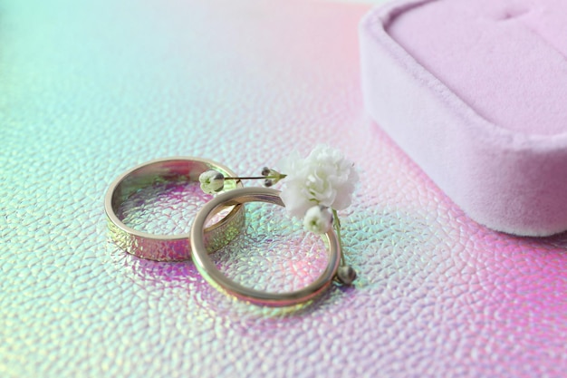 Couple of wedding rings on textured background