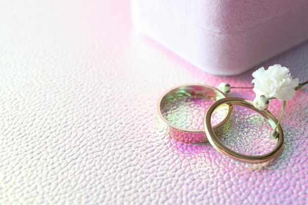 Couple of wedding rings on textured background