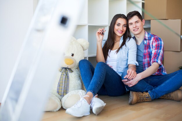 A couple with boxes moves to a new house