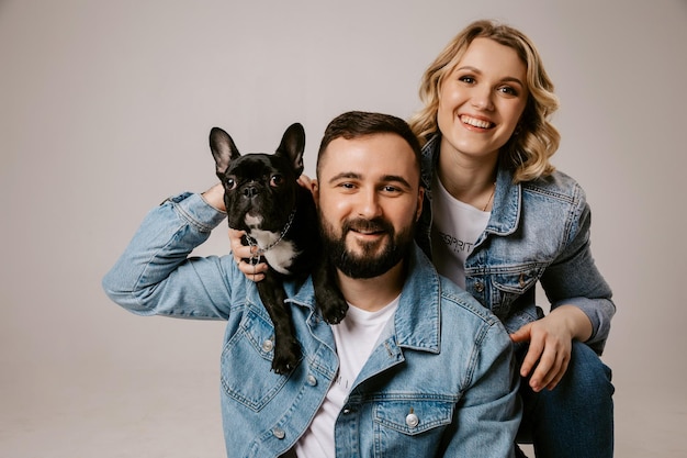 Couple with dog happy family with bulldog