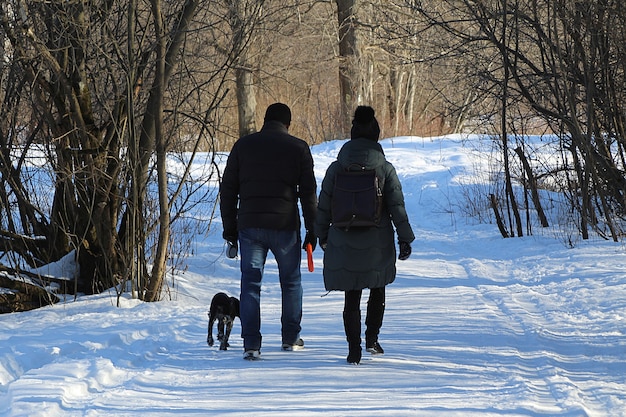 Couple with dog walking in the park