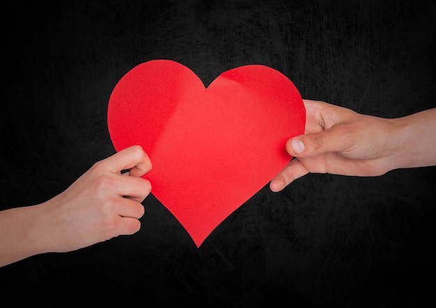 Couple with heart and black background