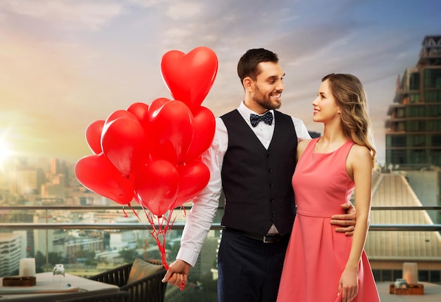 couple with heart shaped balloons in singapore