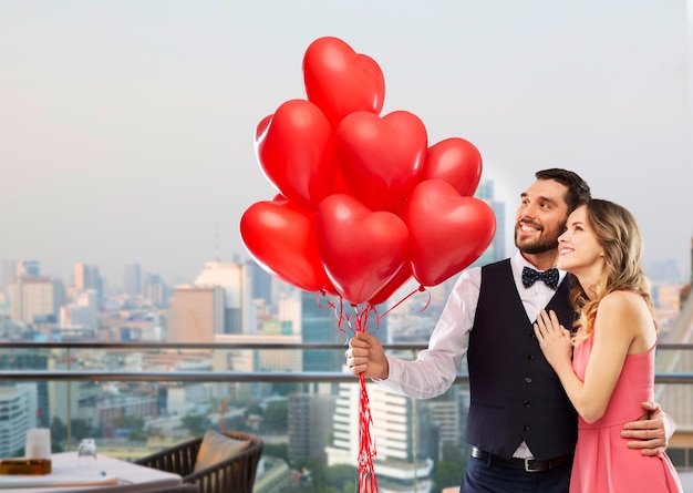 couple with heart shaped balloons in singapore