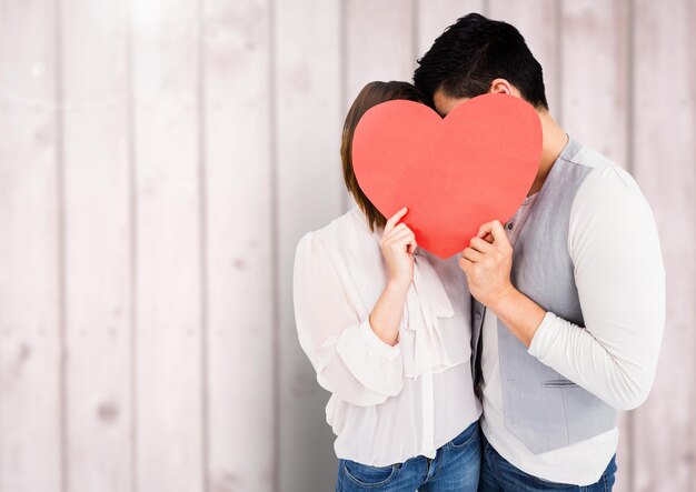 couple with hearts against wood background