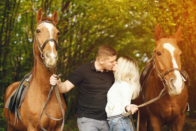 Photo couple with horses