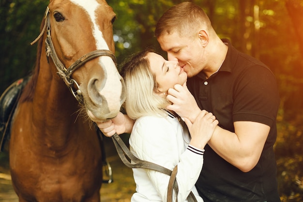 Photo couple with horses