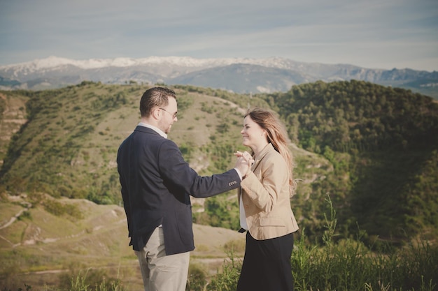 Couple with mountains in background