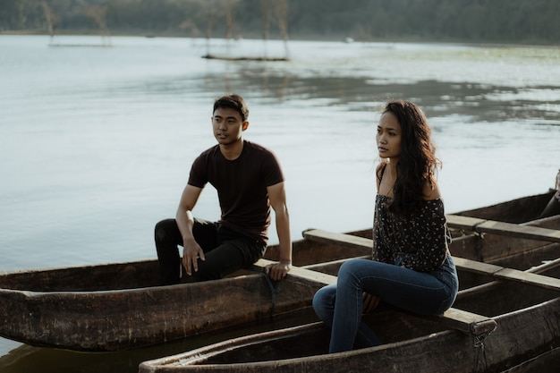 Couple with traditional canoe together on a lake