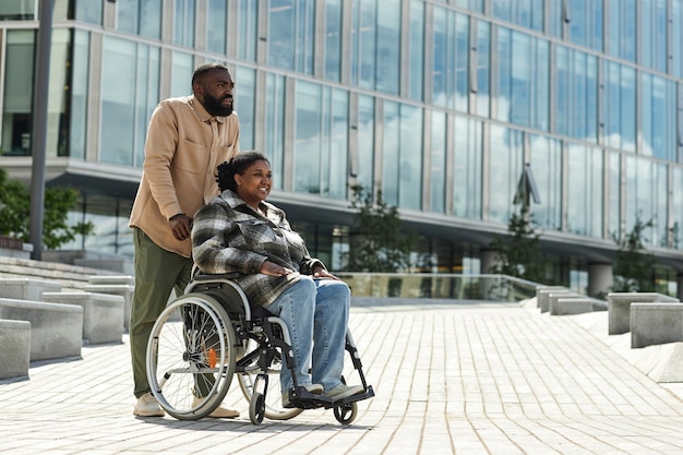 Couple with Woman in Wheelchair City Setting