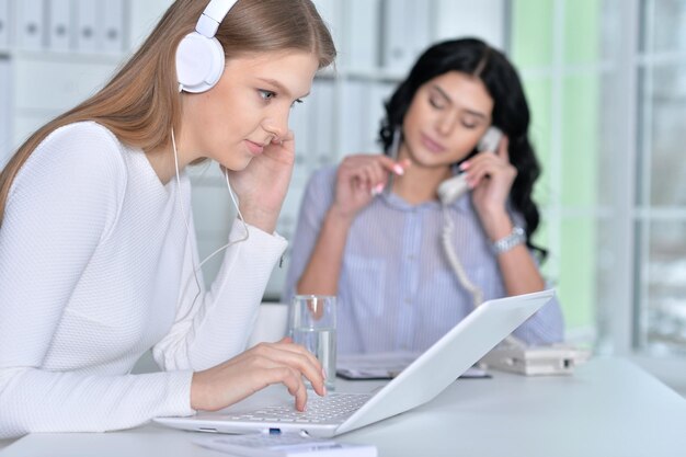 Couple of women are working in the office