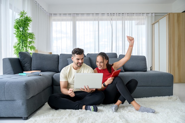 A couple working from home together with happiness and good emotion