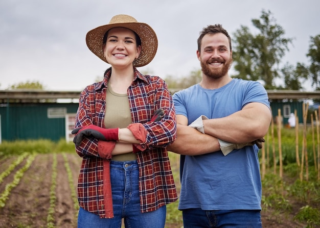 Couple working on garden field and nature environment for plant growth sustainability agriculture and green farming in countryside Portrait of happy smile and success farmer gardening on land