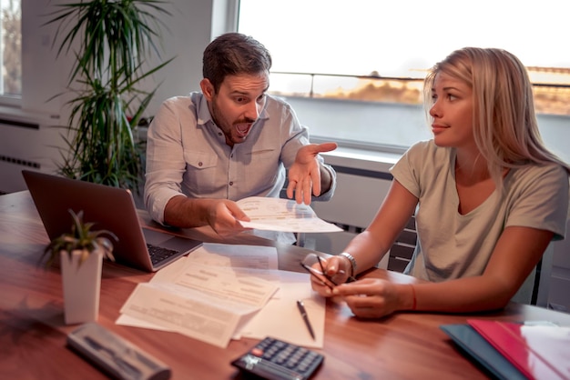 Photo couple working on home finance with laptop