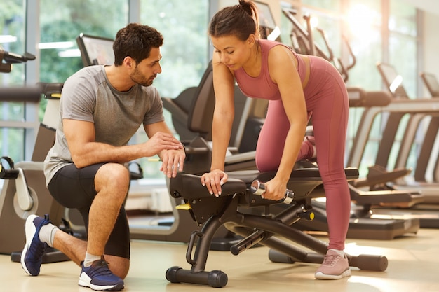 Couple Working Out in Gym