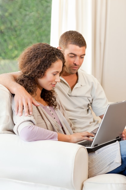 Couple working on their laptop at home