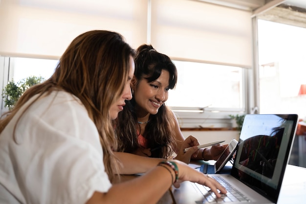 Couple working with laptop and tablet